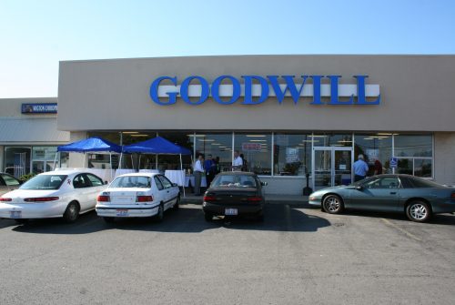 Goodwill store exterior, one-story brick and stucco building in shopping center