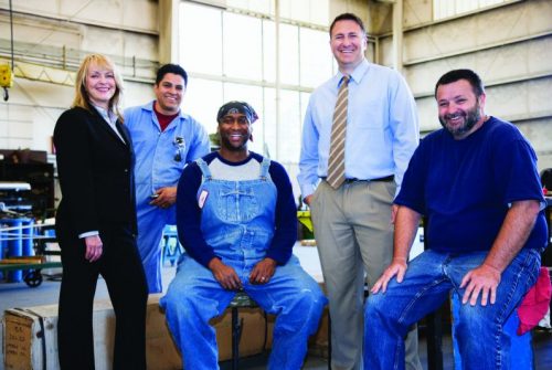 Diverse group of men and women in business suits or work overalls